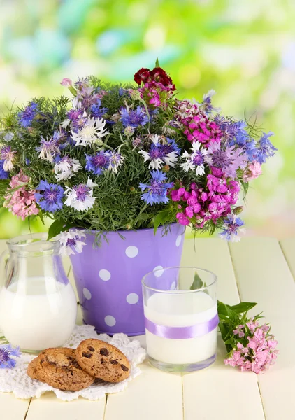 Beautiful bouquet in pail on wooden table on natural background — Stock Photo, Image