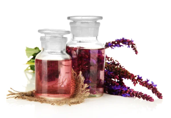 Medicine bottles with salvia flowers, isolated on white — Stock Photo, Image