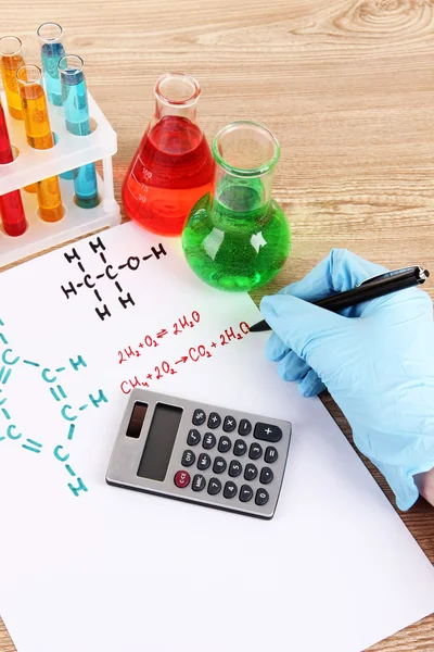 Hand scientist writing formulas — Stock Photo, Image