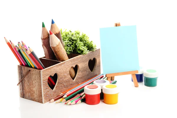 Different pencils in wooden crate, paints and easel, isolated on white — Stock Photo, Image