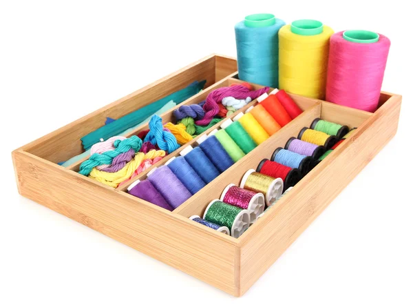 Colorful threads for needlework in wooden box isolated on white — Stock Photo, Image