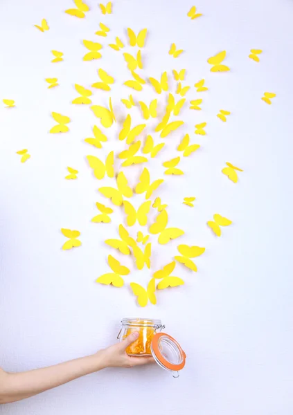 Paper yellow butterflies fly out of bank — Stock Photo, Image