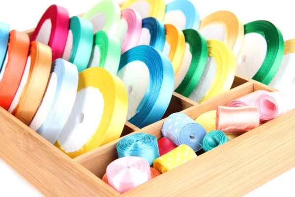 Bright silk ribbons in wooden box, close up — Stock Photo, Image