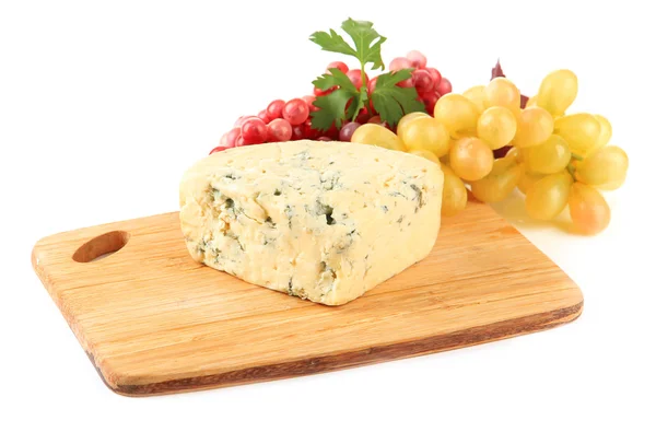 Tasty blue cheese and grape on cutting board, isolated on white — Stock Photo, Image