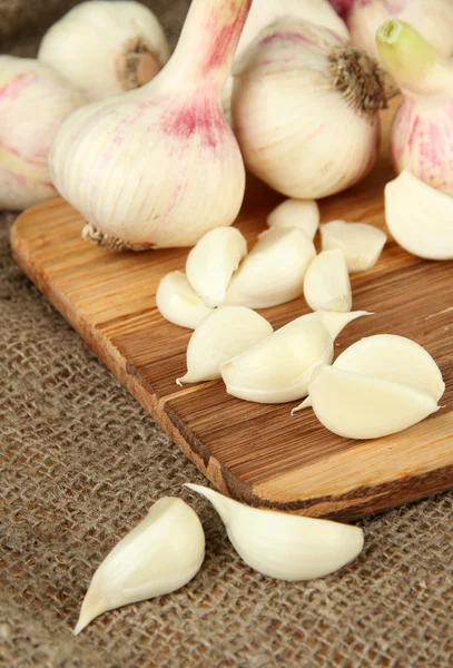 Fresh garlic, on sackcloth background — Stok fotoğraf
