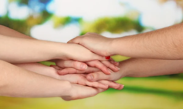 Many hands on nature background — Stock Photo, Image