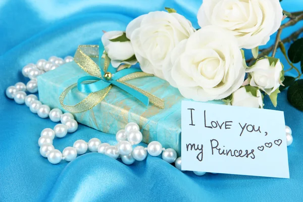 Romantic parcel on blue cloth background Stock Image