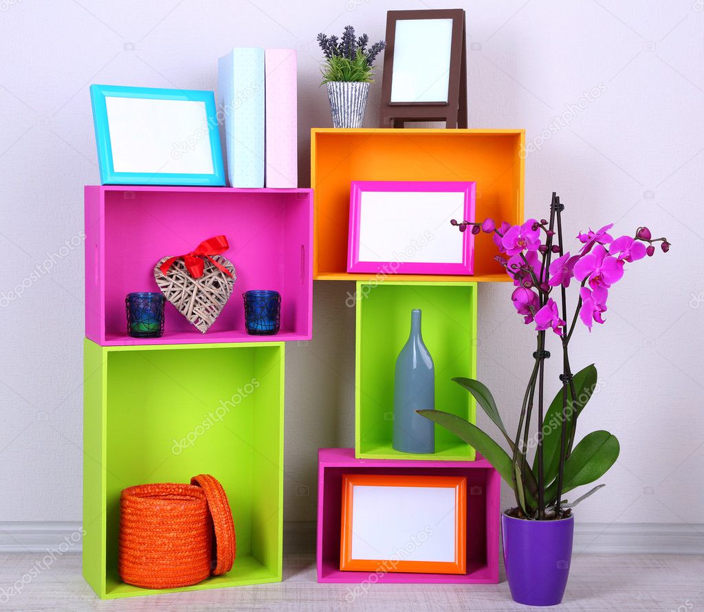 Beautiful colorful shelves with different home related objects