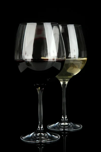 Two glasses of red and white wine, isolated on black — Stock Photo, Image