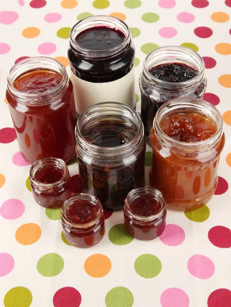 Tasty jam in banks on table — Stock Photo, Image