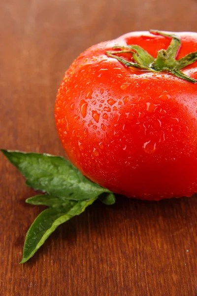 Fresh tomato on wooden background — Stock Photo, Image