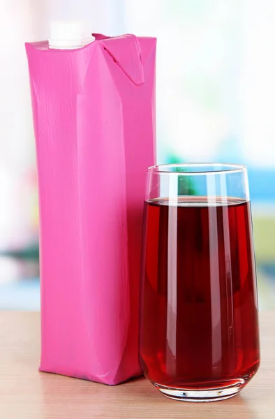 Juice pack on table in kitchen — Stock Photo, Image