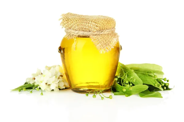 Pot met honing met bloemen van acacia en kalk, geïsoleerd op wit — Stockfoto