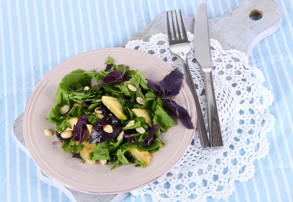Light salad on plate on napkin — Stock Photo, Image