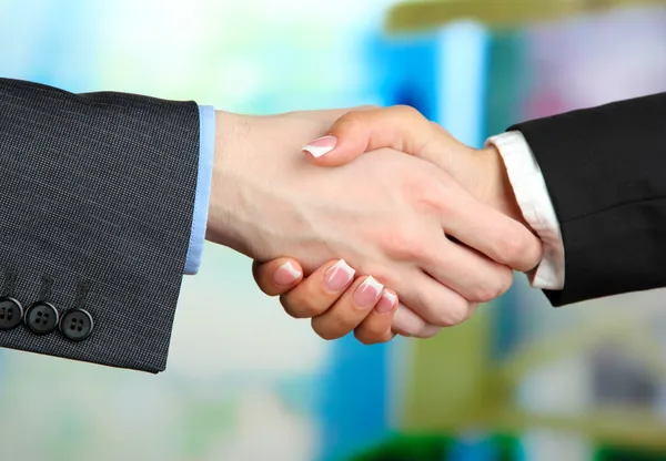 Business handshake on bright background — Stock Photo, Image