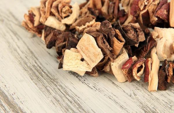 Dried mushrooms on wooden background — Stock Photo, Image