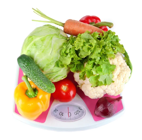 Fresh vegetables on scales on grey background — Stock Photo, Image