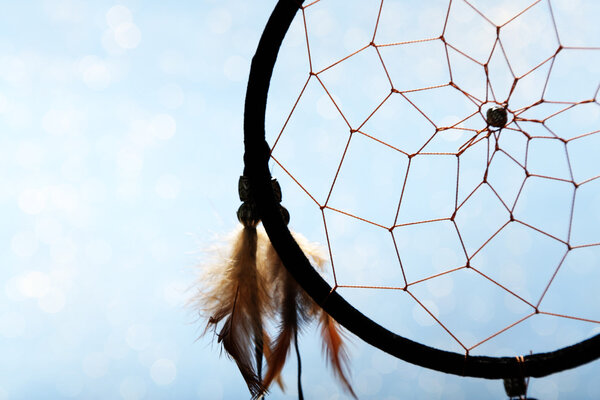 Beautiful dream catcher on blue background
