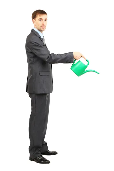 Young businessman pouring water from watering can isolated on white — Stock Photo, Image