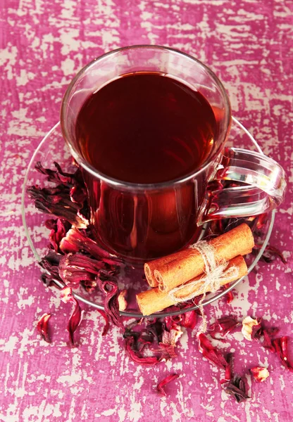 Herbal tea in glass cup, on color wooden background — Stock Photo, Image