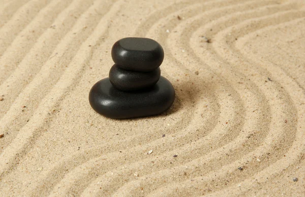 Zen garden with raked sand and round stones close up — Stock Photo, Image