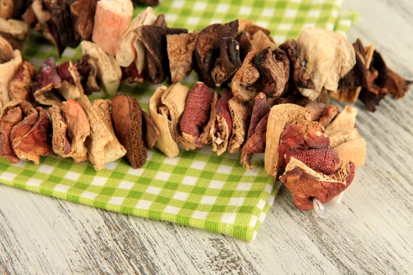 Dried mushrooms on wooden background — Stock Photo, Image