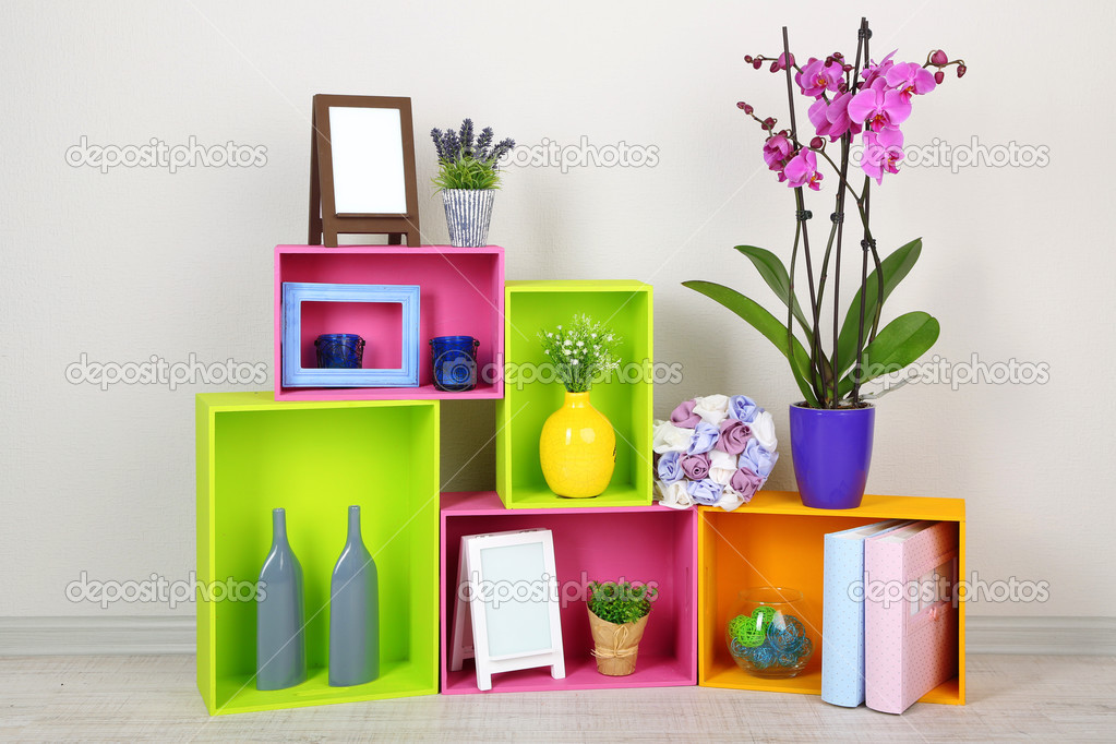 Beautiful colorful shelves with different home related objects