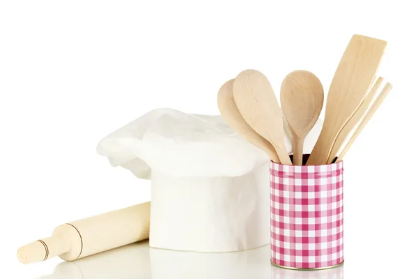 Chef's hat with spoons and battledore isolated on white — Stock Photo, Image