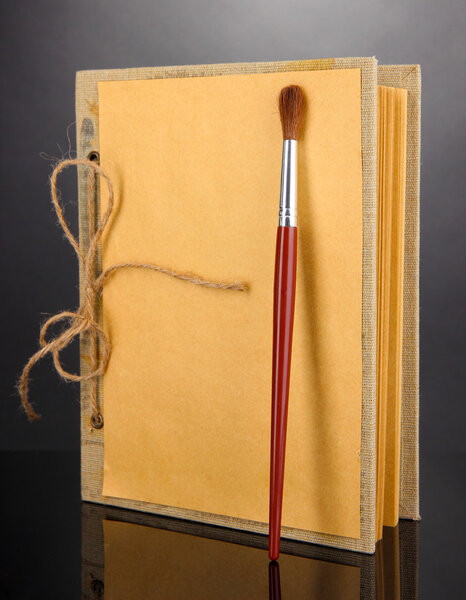 Beautiful old notebook on grey background