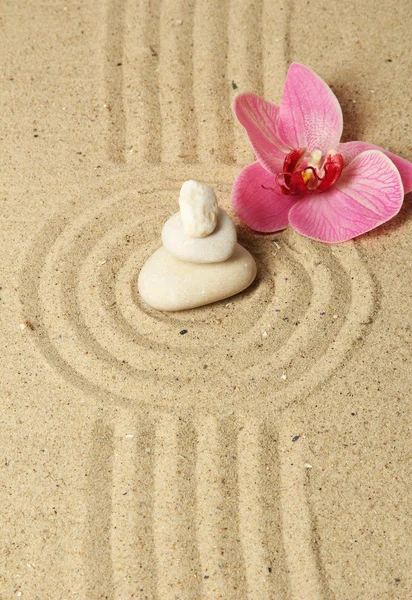 Zen garden with raked sand and round stones close up — Stock Photo, Image