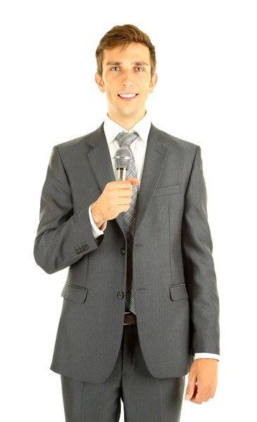 Jonge zakenman praten met microfoon, geïsoleerd op wit — Stockfoto