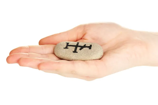 Fortune telling with symbols on stone in hand isolated on white — Stock Photo, Image