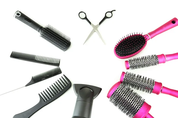 Comb brushes, hairdryer and cutting shears, isolated on white — Stock Photo, Image