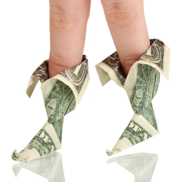 Dollars folded into boots on fingers of woman's hand isolated on white — Stock Photo, Image