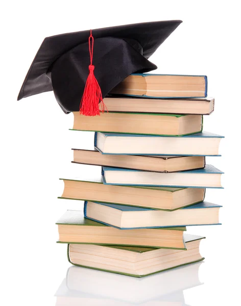 Καπέλο grad με βιβλία που απομονώνονται σε λευκό — Φωτογραφία Αρχείου