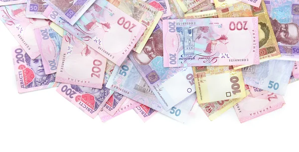 Hromady ukrajinských peněz, izolované na bílém — Stock fotografie