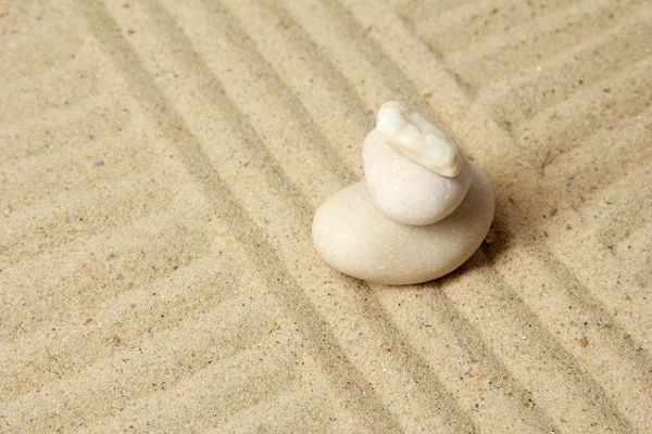 Zen garden with raked sand and round stones close up — Stock Photo, Image