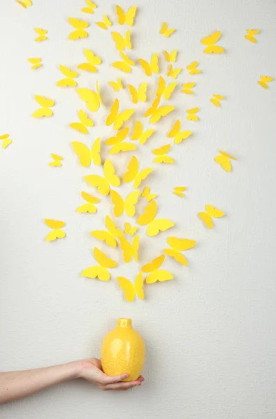 Paper yellow butterflies fly out of vase — Stock Photo, Image