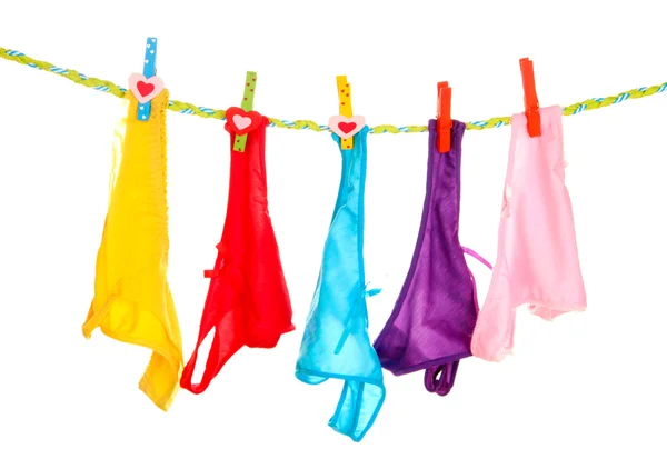 Women's panties hanging on rope isolated on white — Stock Photo, Image