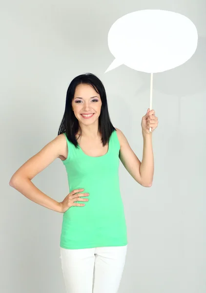 Thought girl in bubble next to it on grey background — Stock Photo, Image