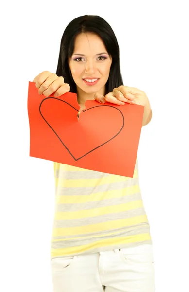 Joven mujer lagrima papel pintado corazón sobre fondo gris — Foto de Stock