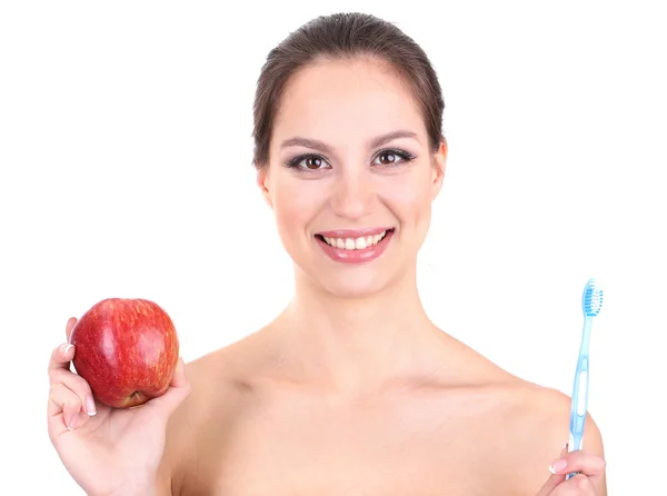 Donna sorridente con mela e spazzolino isolato su bianco — Foto Stock