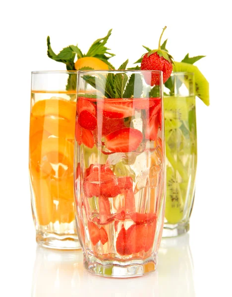 Glasses of fruit drinks with ice cubes isolated on white — Stock Photo, Image