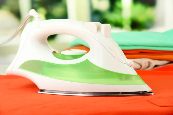 Steam iron on bright background — Stock Photo, Image