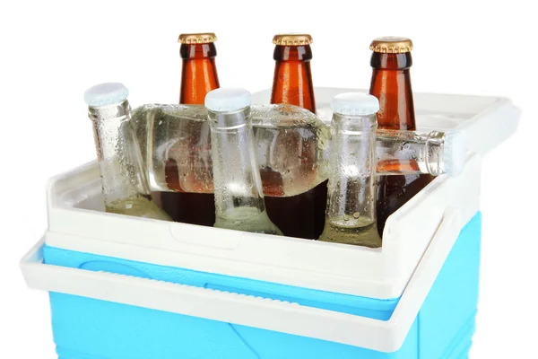 Traveling refrigerator with beer bottles and ice cubes isolated on white — Stock Photo, Image
