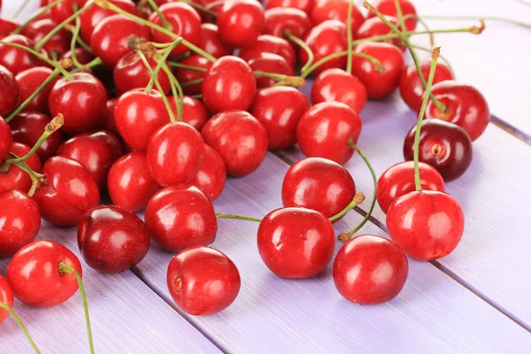 Cherry berries on wooden table — Stock Photo, Image