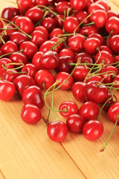 Cherry berries on wooden table — Stock Photo, Image