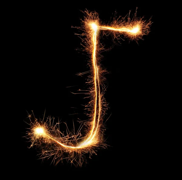 Letter "J" sparklers on black background — Stock Photo, Image