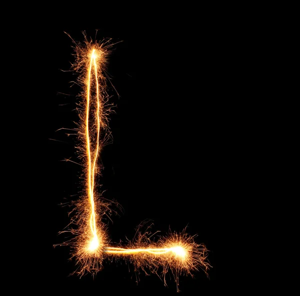 Letter "L" sparklers on black background — Stock Photo, Image