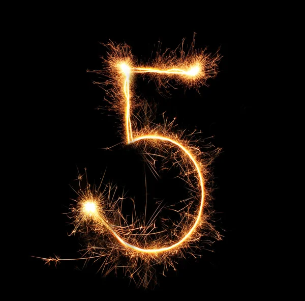 Number "five" sparklers on black background — Stock Photo, Image
